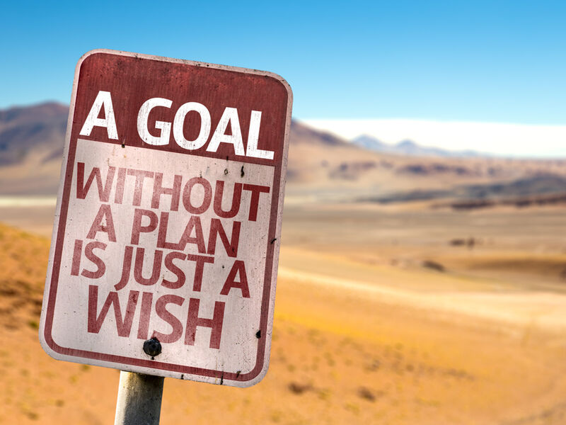 A Goal Without a Plan Is Just A Wish sign with a desert background